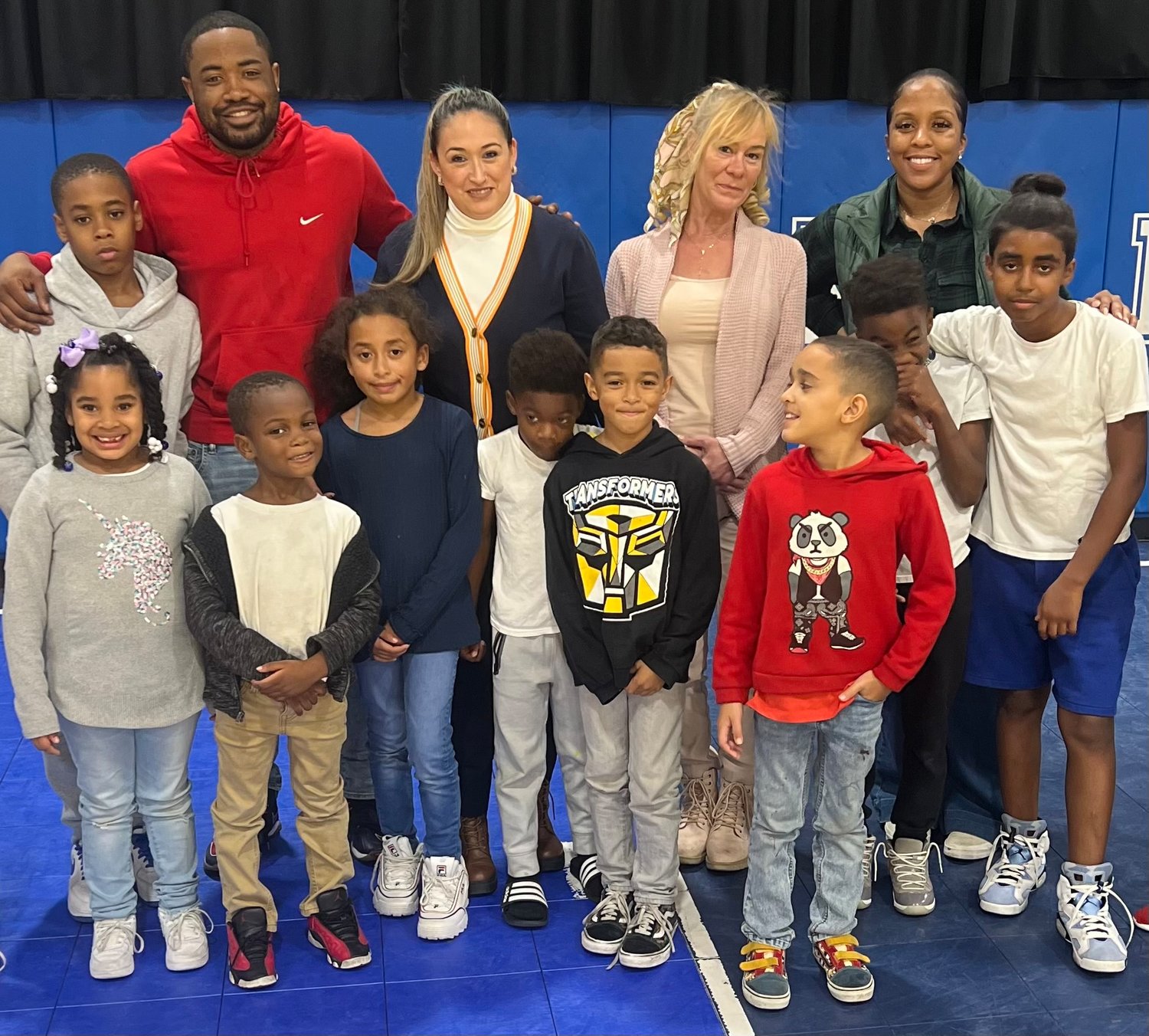 Gia Puma, second from right in back row, joined MLK board members, from left, Cedrick Coad, Andrea Gauto and Melissa Spleen when she met some of the center’s kids on Tuesday.
